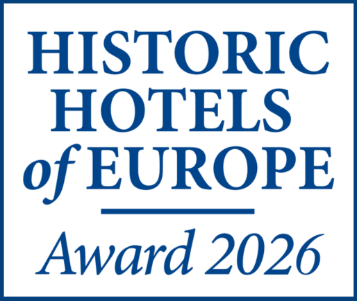Blue and white logo with the text “HISTORIC HOTELS of EUROPE Award 2026” in capital letters.