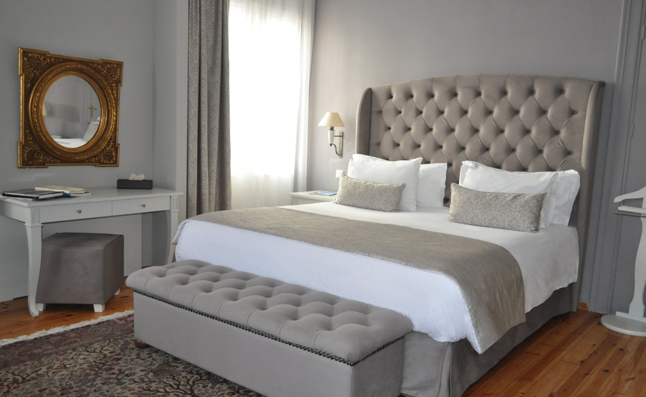 A bed in a bedroom at the Capsis Bristol Boutique Hotel.