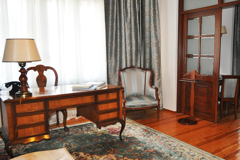 A room in the Capsis Bristol Boutique Hotel with a desk and chair.