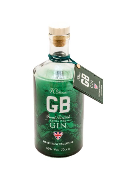 Bottiglia in vetro trasparente di J.J. Whitley GB Great British Extra Dry Gin con tappo in sughero ed etichetta verde, etichettata come Heathrow Exclusive, 700 ml, 40% di alcol.